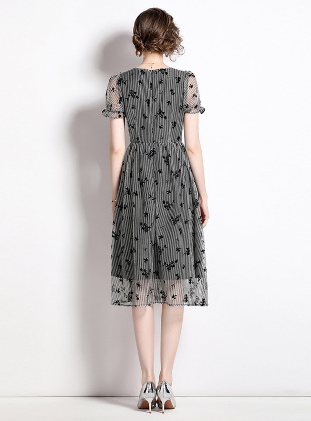 A Line dress with puffed sleeves and a wrap skirt.